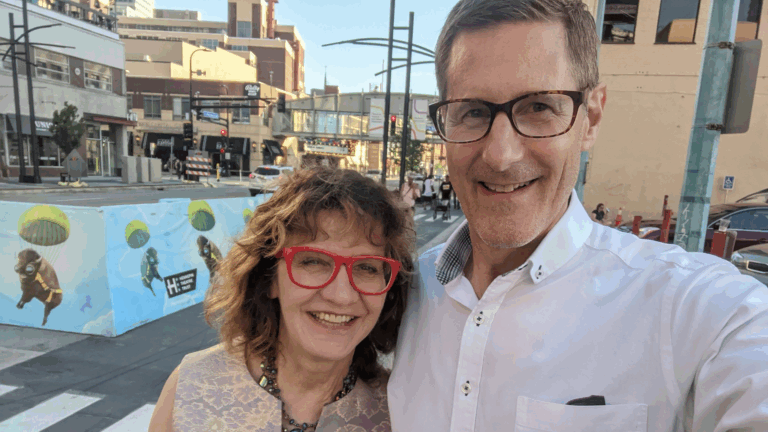 A couple smiles for the camera