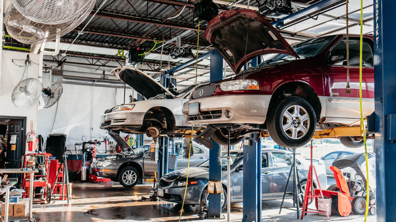 Cars raised up via a lift to be repaired